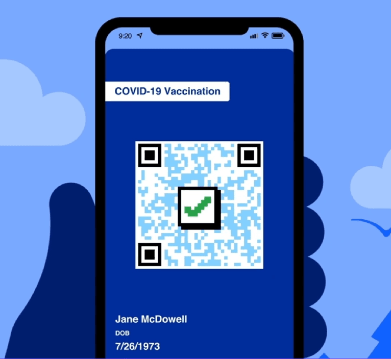 hand holding a phone which is displaying a COVID-19 vaccination app